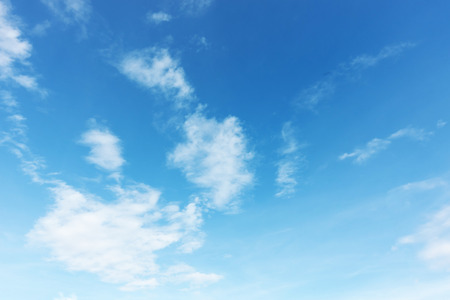 Blue sky background and white clouds soft focus, and copy space.の写真素材