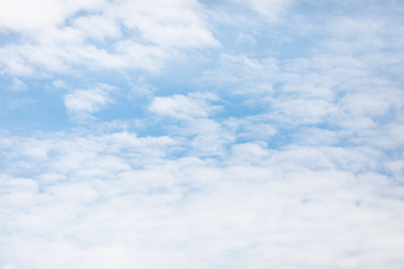 Blue sky background and white clouds soft focus, and copy space.の写真素材