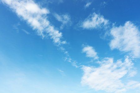 Blue sky background and white clouds soft focus, and copy space.の写真素材