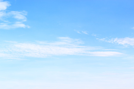 Blue sky background and white clouds soft focus, and copy space.の写真素材