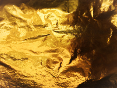 Gold paper abstract background or texture and gradients shadow.の写真素材