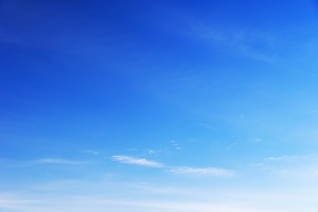 Blue sky background and white clouds soft focus, and copy space.の写真素材