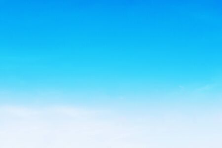 Blue sky background and white clouds soft focus, and copy space.の写真素材