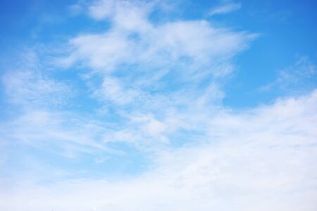Blue sky background and white clouds soft focus, and copy space.の写真素材