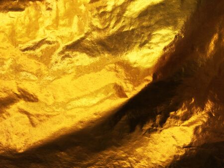 Gold abstract background or texture and gradients shadow.の写真素材