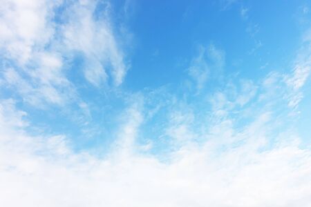 Blue sky background and white clouds soft focus, and copy space.の写真素材
