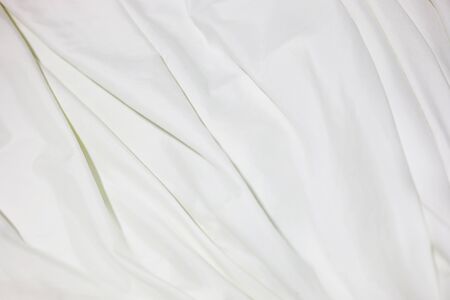 Close up of white bedding sheets soft focus and copy space.の写真素材