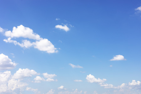 Blue sky background and white clouds soft focus, and copy space.の写真素材