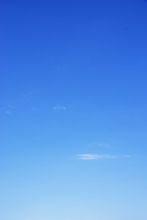 Soft white clouds against blue sky background and copy space.の写真素材