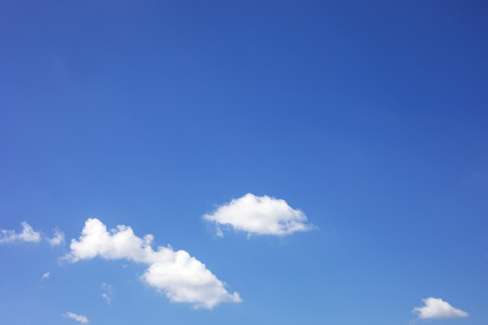 Blue sky background and white clouds soft focus, and copy space.の写真素材
