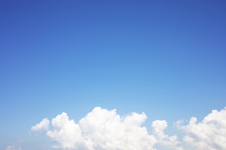 Blue sky background and white clouds soft focus, and copy space.の写真素材