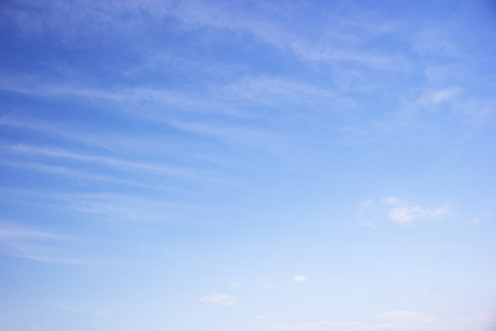 Fantastic soft white clouds against blue skyの写真素材