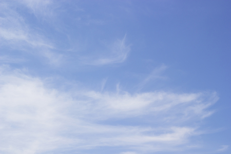 Fantastic soft white clouds against blue skyの写真素材