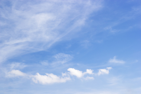 Fantastic soft white clouds against blue skyの写真素材