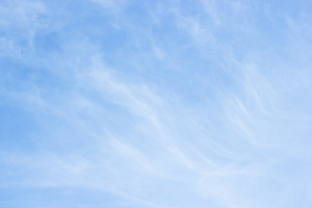 Fantastic soft white clouds against blue skyの写真素材