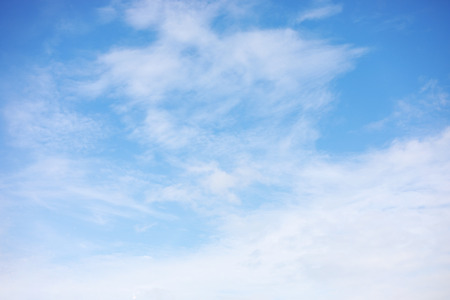 Fantastic soft white clouds against blue skyの写真素材