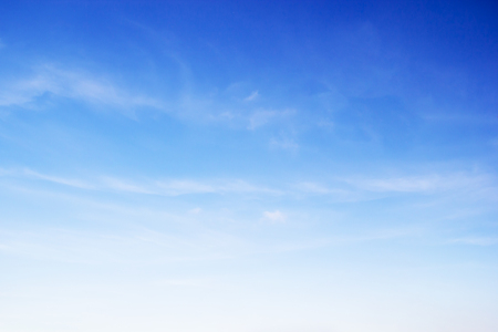 Fluffy blue sky background and white clouds soft focus, and copy space.の写真素材