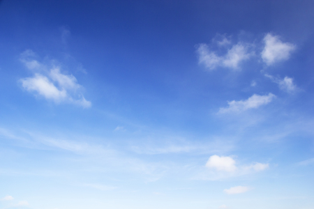 Blue sky background and white clouds soft focus, and copy space.の写真素材