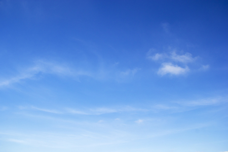 Blue sky background and white clouds soft focus, and copy space.の写真素材