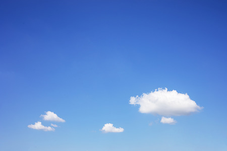 Blue sky background and white clouds soft focus, and copy space.の写真素材