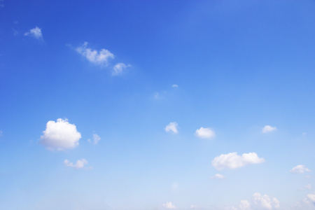 Blue sky background and white clouds soft focus, and copy space.の写真素材
