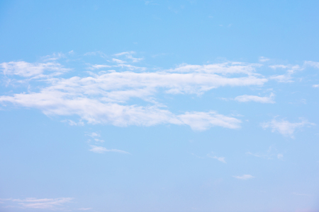 Blue sky background and white clouds soft focus, and copy space.の写真素材