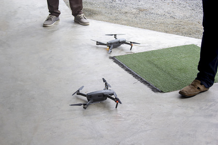 Black 2 drone on concrete floor and copy spaceの写真素材