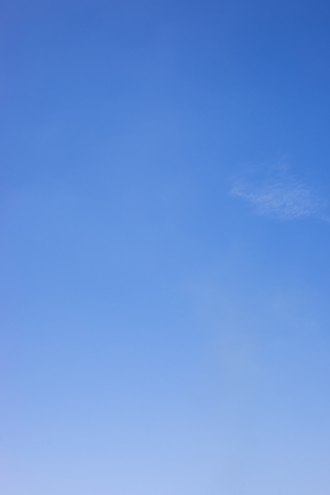 Blue sky background and white clouds soft focus, and copy space.