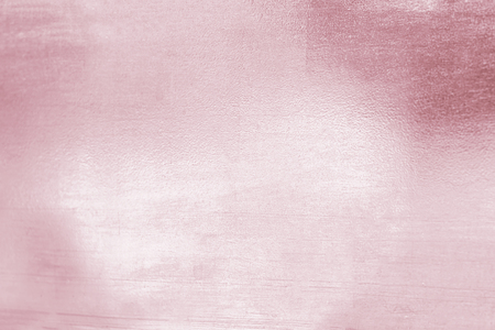 Pink metal rose gold tone background or texture and gradients shadow for valentines.の写真素材