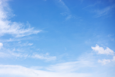 Blue sky background and white clouds soft focus, and copy space.の写真素材