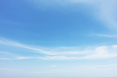 Blue sky background and white clouds soft focus, and copy space.の写真素材