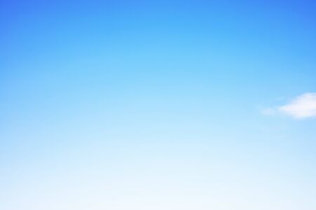 Blue sky background and white clouds soft focus, and copy space.の写真素材