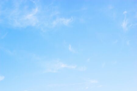 Blue sky background and white clouds soft focus, and copy space.の写真素材