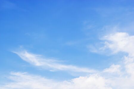 Blue sky background and white clouds soft focus, and copy space.の写真素材