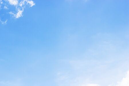 Blue sky background and white clouds soft focus, and copy space.の写真素材