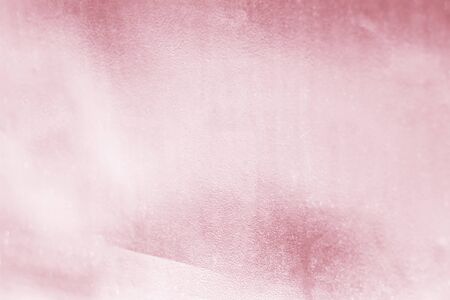 Pink metal rose gold tone background or texture and gradients shadow for valentines.の写真素材