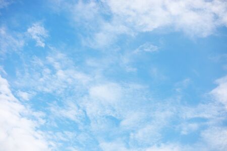 Blue sky background and white clouds soft focus, and copy space.の写真素材