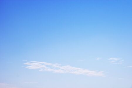 Blue sky background and white clouds soft focus, and copy space.の写真素材