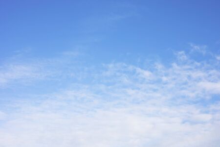 Blue sky background and white clouds soft focus, and copy space.の写真素材