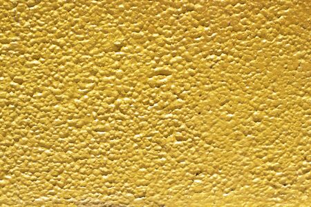 Gold abstract concrete wall background or textureの写真素材