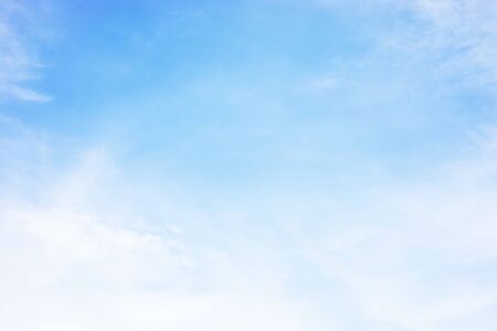 Blue sky background and white clouds soft focus, and copy space.の写真素材