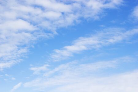 Blue sky background and soft white clouds, copy space.の写真素材