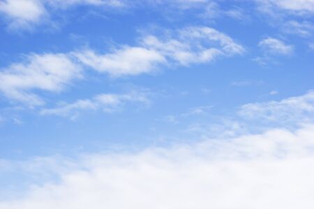 Blue sky background and white clouds soft focus, and copy space.の写真素材