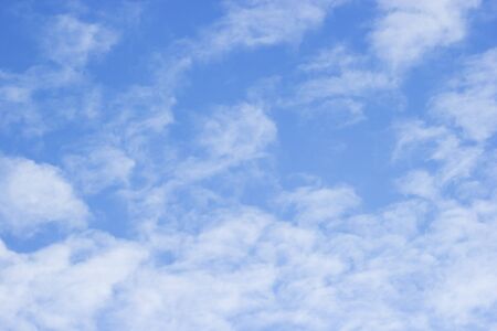 Blue sky background and white clouds soft focus, and copy space.の写真素材