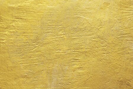 Gold abstract concrete wall background or textureの写真素材