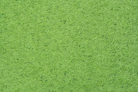 Green fake grass texture or background and copy spaceの写真素材