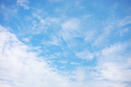 Blue sky background and white clouds soft focus, and copy space.の写真素材