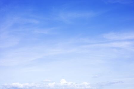 Blue sky background and white clouds soft focus, and copy space.の写真素材