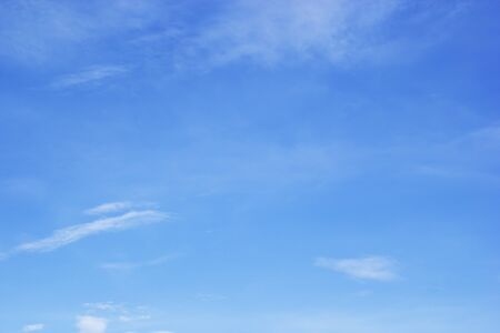 Blue sky background and white clouds soft focus, and copy space.の写真素材