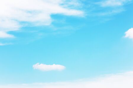 Blue sky background and white clouds soft focus, and copy space.の写真素材